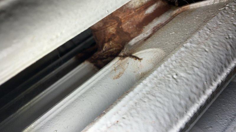 Responded to service call for leaking radiator in residential property. Upon inspection, discovered severe rust and corrosion on copper piping connected to boiler radiator system located in basement, with active water leak causing damage to equipment. Performed diagnostic evaluation of heating system components, identified compromised pipe integrity and deteriorated radiator connections as source of leak. Documented equipment condition through photographic evidence showing extensive corrosion on copper lines and aging radiator unit. Advised homeowner of findings and provided recommendations for necessary repairs to prevent further water damage and restore proper heating system operation.