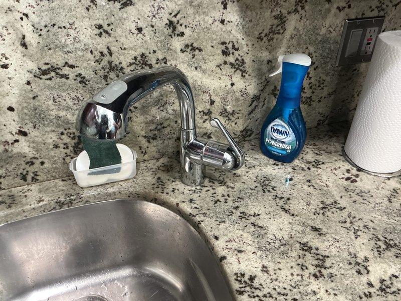 Responded to service call for toilet not filling after flushing in one bathroom and malfunctioning kitchen sink handheld sprayer. Diagnosed and repaired toilet fill valve issue to restore proper tank refilling operation. Inspected kitchen sink sprayer assembly, identified defective diverter or hose connection, and completed necessary repairs to restore full functionality of the handheld spray unit.