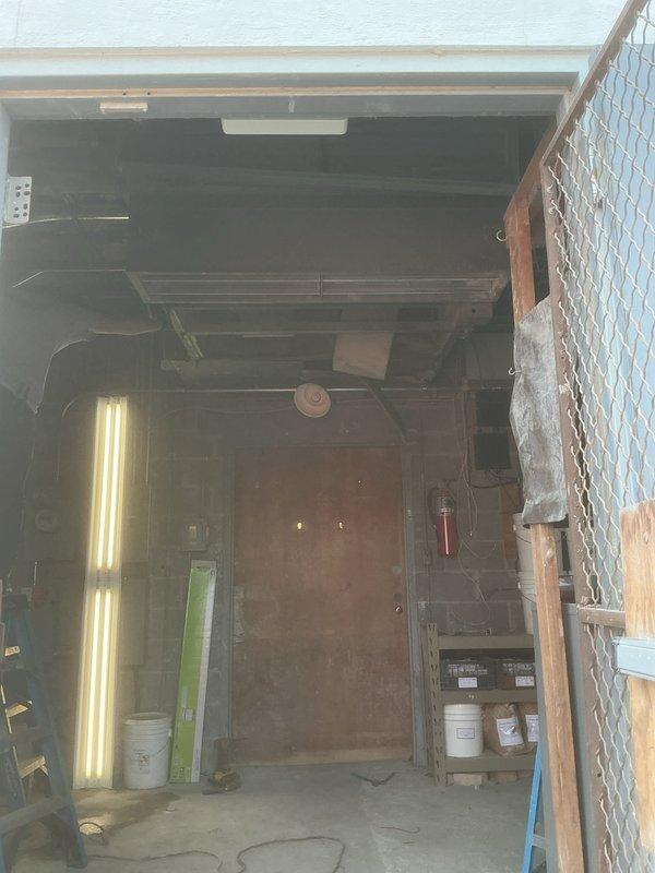 # Commercial Air Handler Installation

Completed a four-day commercial air handler installation in a utility/mechanical room. The installation involved mounting new HVAC equipment, routing ductwork through the existing ceiling structure with exposed joists, and integrating the system with the building's electrical panel. All work was performed in accordance with commercial building codes, ensuring proper clearances around equipment for future maintenance access, and the system was tested for optimal performance upon completion.