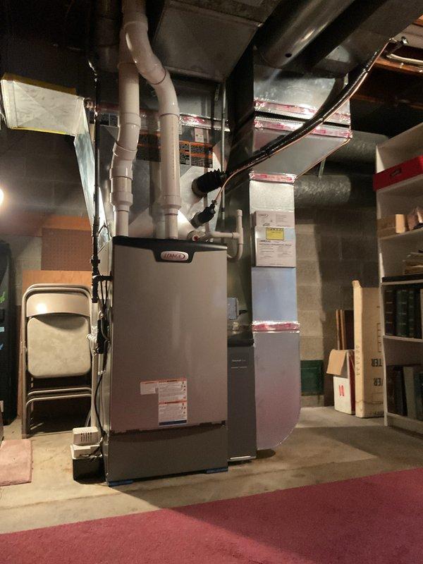 Completed full HVAC system installation in residential basement including 110,000 BTU Lennox furnace, 4-ton air conditioning unit with rear discharge configuration, and whole-home humidifier. Installed new ductwork with insulation, connected PVC drainage and ventilation piping, and integrated humidifier to main supply plenum. Reconnected electrical service, performed system startup and calibration, and verified proper airflow and operation of all components. Applied for mechanical and electrical permits and submitted documentation for utility rebate programs.