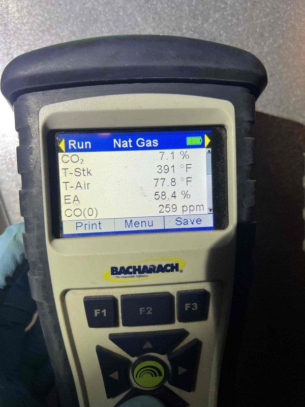 Performed comprehensive tune-up on 2021 furnace located in basement utility room. Conducted full combustion analysis using calibrated diagnostic equipment, confirming natural gas system operating within manufacturer specifications with stack temperature at 391°F, CO2 at 7.1%, excess air at 58.4%, and carbon monoxide readings at safe levels. Inspected burner assembly, heat exchanger, blower motor, and ductwork connections; verified all components functioning properly with no safety concerns identified.