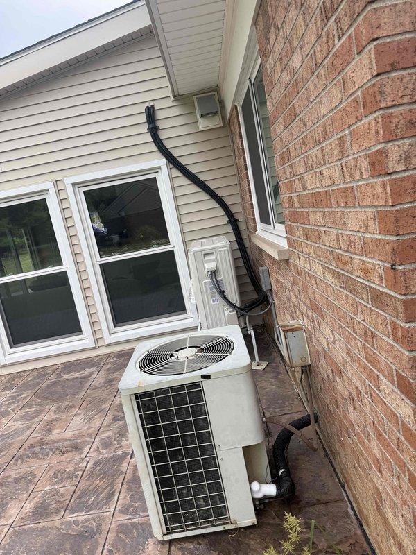 Responded to service call for freezing pipes located behind 14-year-old furnace unit in basement. Upon inspection, assessed HVAC system configuration and environmental conditions contributing to pipe freeze issue. Documented equipment installation and exterior condenser unit positioning for comprehensive service records.