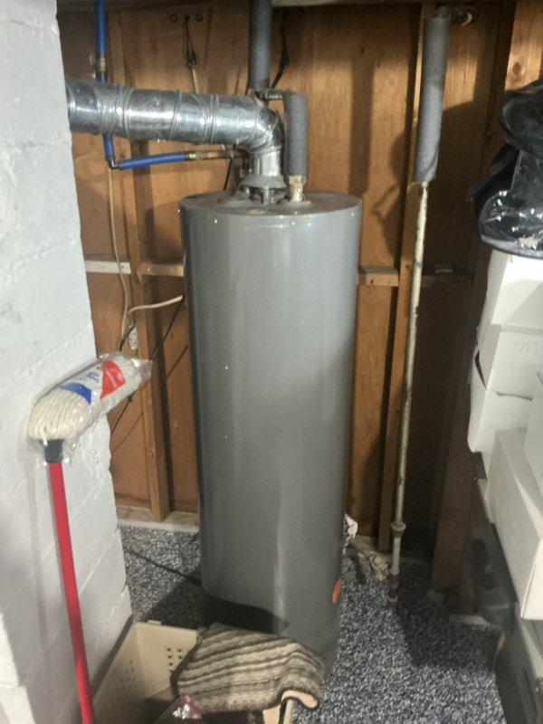 Completed comprehensive Gold Furnace Inspection on 8-year-old HVAC system located in basement. Performed thorough examination of furnace unit, including burner assembly, heat exchanger, blower motor, and all safety controls. Inspected Aprilaire humidifier mounted on furnace for proper operation and water supply connections. Verified all electrical connections, tested thermostat functionality, and examined venting system for proper installation and clearances. Checked air conditioning unit for refrigerant levels, condenser coil condition, and electrical components. Inspected all ductwork connections, PEX plumbing lines, and flexible vent piping for secure installation. Confirmed furnace filter condition and verified proper airflow throughout system. All safety switches, limit controls, and pressure switches tested and operating within manufacturer specifications. System running efficiently with no immediate concerns identified. Documented equipment condition with photos for maintenance 