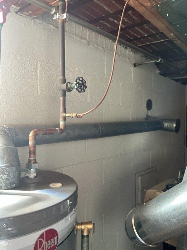 Completed comprehensive Gold Furnace Inspection on 11-year-old furnace unit located in basement. Performed full system evaluation including visual inspection of all components, burner assembly, heat exchanger, blower motor, and electrical connections. Verified proper operation of safety controls, tested ignition system, and confirmed adequate airflow throughout the system. Inspected and documented condition of associated mechanical equipment in utility area, including water heater and plumbing connections showing age-related copper oxidation on piping. All furnace components found to be functioning within normal operating parameters for equipment age. System operating safely with no immediate concerns identified during inspection.