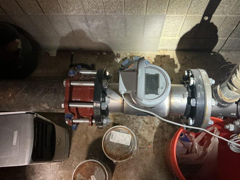 Responded to service call to assess plumbing situation following wall opening and address concerns regarding incomplete toilet repairs from previous visit. Conducted thorough inspection of dual-sink bathroom installation with exposed PVC drainage system and documented existing conditions. Evaluated mechanical room piping infrastructure including flow meter installation with flanged connections and associated equipment to determine scope of required plumbing work and provide recommendations for resolution of outstanding issues.