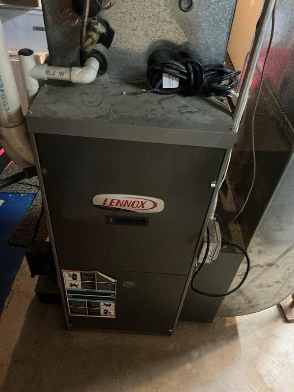 Responded to service call for non-operational blower motor on a 20-year-old Lennox furnace located in basement. Upon inspection, determined that due to age of unit and extent of necessary repairs, provided comprehensive estimate for complete furnace replacement system. Documented existing equipment condition including furnace cabinet, ductwork connections, venting configuration, and water heater proximity for replacement planning purposes.