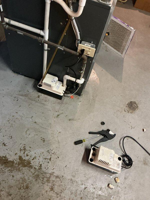 Responded to no cooling call on 10-year-old residential air conditioning system. Upon arrival, confirmed outdoor condenser unit was not operating and indoor system was unresponsive. Performed diagnostic testing using digital multimeter to check electrical components and voltage readings at both indoor air handler and outdoor condensing unit. Identified failed condensate pump preventing system operation due to safety float switch activation. Replaced defective condensate pump with new unit, reconnected drain lines, and verified proper drainage function. Tested system startup sequence, confirmed 24V control circuit operation, and verified compressor and condenser fan engagement. System restored to full cooling operation with all safety controls functioning properly.