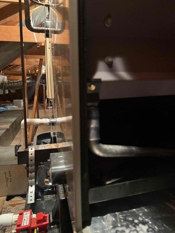 Responded to urgent water leak call for six-year-old AC system located in attic. Upon arrival, inspected attic-mounted air handler and identified clogged condensate drain line causing water overflow and ceiling damage below unit. Cleared blockage from primary drain line, verified proper drainage flow, and tested secondary drain pan for integrity. System remained operational throughout service and was cooling properly. Recommended monitoring ceiling area for any additional moisture concerns and advised scheduling preventive maintenance to avoid future drainage issues.