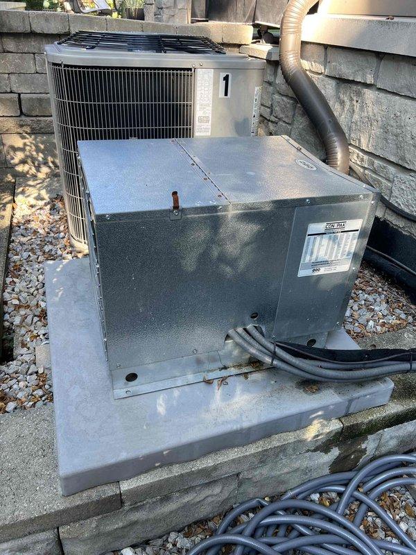 Completed callback diagnostic on approximately 10-year-old mini split system serving wine cellar with reported ice buildup and possible 20-amp cartridge failure. Unit had been powered down 24 hours prior to appointment as recommended to allow ice to thaw. Upon arrival, performed visual inspection of indoor evaporator unit with cover removed, revealing insulation, fan assembly, and internal components. System still in thawing process, preventing complete diagnostic testing of refrigerant circuit and electrical components. Documented current condition with photos showing evaporator coil assembly and exterior condensing unit installation. Unable to complete full diagnostic evaluation due to incomplete thawing of ice accumulation on evaporator coil. Callback appointment required to finalize diagnostic testing once unit has fully thawed and to determine root cause of ice formation, verify refrigerant charge levels, check airflow restrictions, and test electrical components including suspect