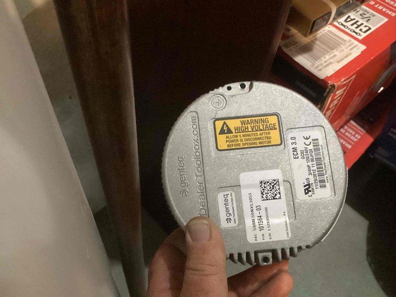 Responded to no cooling complaint on basement-located air conditioning system over 10 years old. Upon inspection, diagnosed failed ECM blower motor preventing airflow distribution throughout the home. Removed defective ECM 3.1 motor assembly and replaced with new unit, reconnected all electrical terminations at junction box, and verified proper motor operation and airflow delivery through ductwork.
