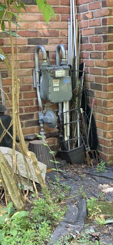 Completed replacement generator installation including electrical panel integration, gas meter connection, and exterior conduit routing. Installed new transfer switch with proper circuit breaker configuration, ran gas piping from meter to generator location with pressure testing per code requirements. All electrical connections terminated at main panel, exterior conduit secured to brick structure, and system tested for proper operation upon completion.
