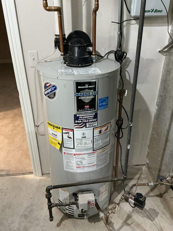 Completed comprehensive tune-up inspection on residential basement HVAC system including furnace and air conditioning unit of unknown age. Performed thorough system evaluation including thermostat functionality check (smart thermostat operating properly, set to cooling mode at 74°F), humidifier inspection, and hot water tank assessment (Bradford White Defender Safety System with Energy Star certification found in good operating condition). All components inspected, tested, and documented with photographic records; system operating within normal parameters with no immediate service requirements identified.