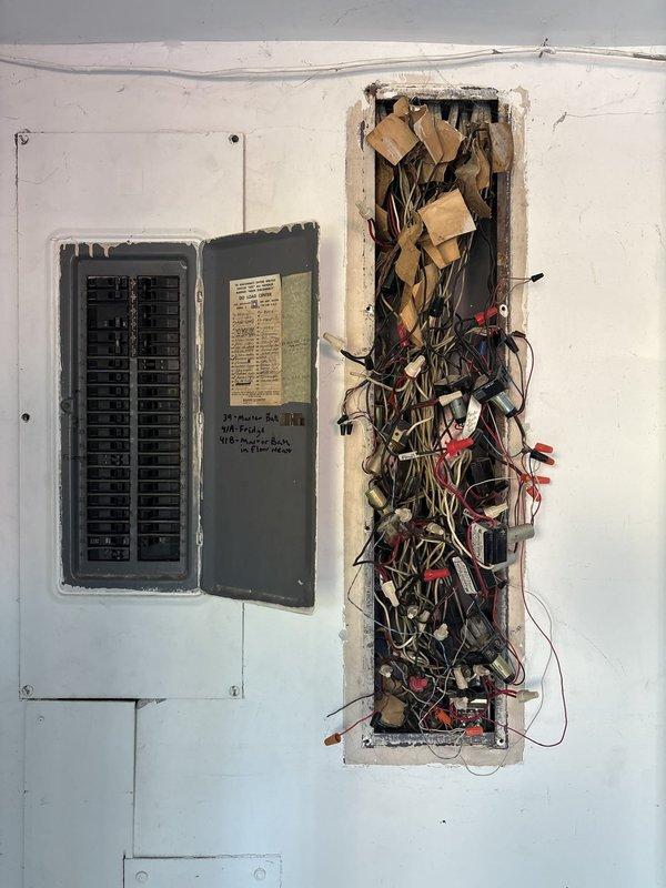 Responded to service call for non-functioning outdoor electrical lamppost. Upon inspection, discovered compromised wiring at the lamppost base and traced circuit back to main electrical panel. Assessed existing wiring infrastructure within wall cavity, identifying tangled and improperly organized conductors requiring attention. Evaluated lamppost fixture and underground feed wiring for damage, wear, and code compliance to determine whether repair or full replacement would be most appropriate solution.