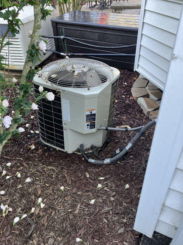 Completed HVAC system estimate for a medium-sized residential property requiring heating and cooling replacement. Assessed existing outdoor condensing unit and heat pump installation located in landscaped area with refrigerant line routing to basement furnace system. Evaluated Generac electrical panel and transfer switch configuration to ensure compatibility with proposed natural gas or propane-fired equipment, documenting current circuit layout including furnace, pump, and auxiliary system connections for integration with new HVAC installation.