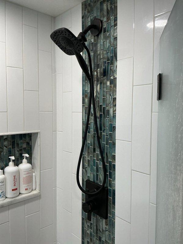 Responded to intermittent hot water loss and pressure fluctuation issues with AO Smith XE3 tankless water heater installed in 2022. Diagnosed surging sounds and pressure changes occurring when multiple fixtures operated simultaneously, particularly noticeable during shower use. Performed system inspection, flushed heat exchanger to remove mineral buildup, adjusted flow sensor calibration, and verified proper gas pressure and venting configuration. Tested unit under multi-fixture demand conditions to confirm consistent hot water delivery and stable pressure throughout the system. Unit now operating within manufacturer specifications with resolved intermittent failure and pressure surge issues.