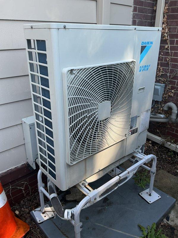 Completed comprehensive Gold membership inspection on 8-year-old HVAC system consisting of basement-located furnace with air handler and outdoor Daikin condensing unit. Began service with exterior AC unit per customer request due to pets, performing visual inspection of condenser cabinet, fan assembly, refrigerant line connections, and electrical conduit routing. Unit showed good overall condition with minimal weathering on cabinet exterior and properly secured mounting platform with PVC support structure. Proceeded to interior furnace inspection after exterior work completed, removing access panel to examine blower motor assembly, electrical connections, capacitors, and control wiring. Verified proper wire terminations at terminal block with color-coded connections intact, inspected blower motor and associated electrical components for signs of wear or damage, and examined refrigerant accumulator and associated piping. All internal components showed normal operating condition with no 