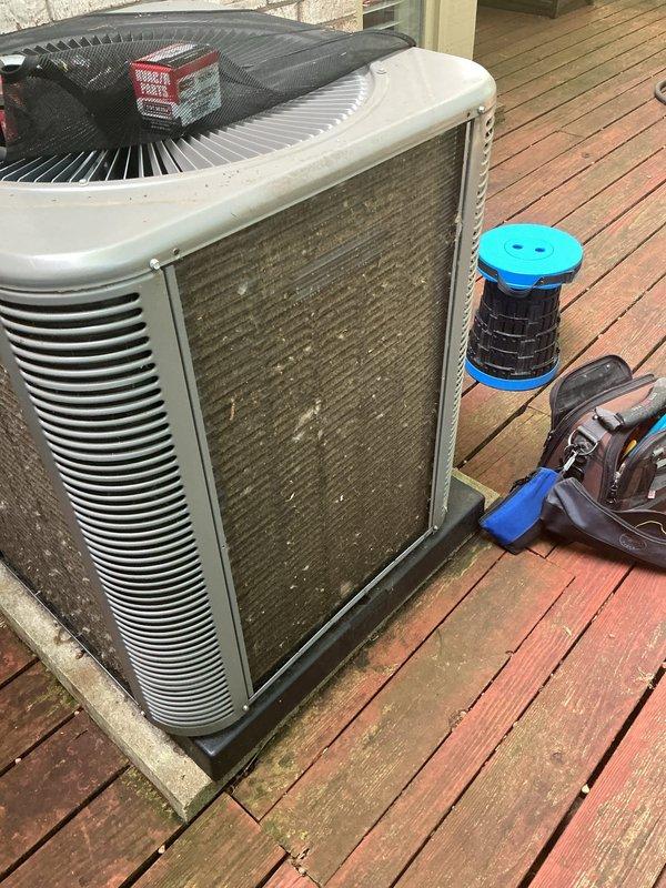 # HVAC Maintenance - Gold AC Inspection

Completed comprehensive Gold AC inspection and tune-up on a 2-year-old Lennox cooling system. System was operating properly upon arrival and remained in good working condition throughout the service. 

Performed thorough inspection of outdoor condensing unit, which showed normal wear consistent with age. Examined electrical components including contactor, capacitor, and control wiring configuration. All electrical connections were secure with proper wire management and cable ties in place. Verified contactor operation and capacitor performance within manufacturer specifications.

Inspected condenser coil and fan assembly with protective grille intact. Assessed refrigerant lines and connections for proper insulation and seal integrity. Evaluated unit placement on deck-mounted concrete pad for proper drainage and clearance. Noted outdoor unit exterior showed typical weathering and surface soiling from environmental exposure.

Verified system cooli