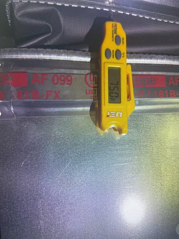 Responded to service call for rooftop unit experiencing refrigerant line freeze-up issues. Performed diagnostic assessment of Lennox commercial A/C unit, taking temperature readings that measured 52°F at the evaporator coil assembly. Replaced faulty motherboard control as requested and inspected refrigerant lines, ductwork connections, and overall unit operation to identify root cause of freezing condition.