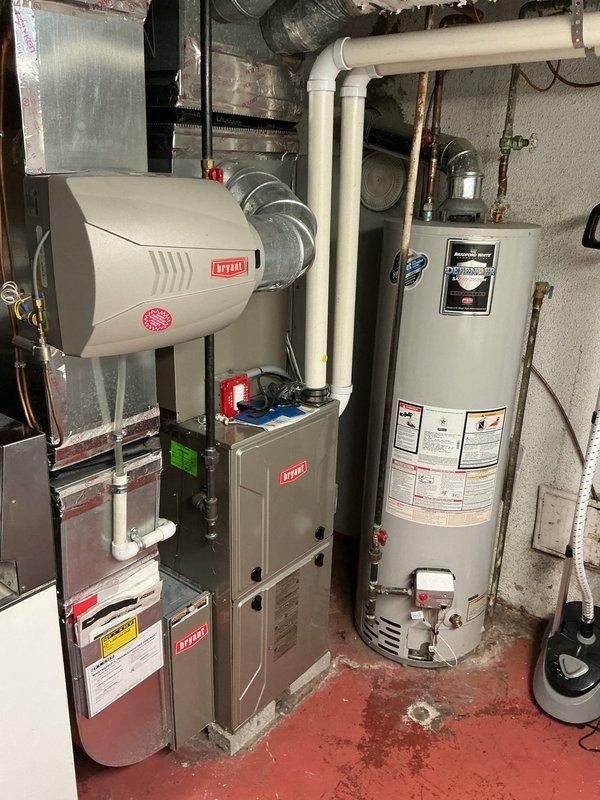 Completed comprehensive prepaid maintenance service on a 9-year-old Bryant forced air furnace system located in basement. Performed full system inspection including burner assembly, heat exchanger, blower motor, and all safety controls. Verified proper operation of integrated humidifier unit and confirmed all ductwork connections were secure. Checked and documented thermostat functionality with heating and cooling setpoints operating within normal parameters. All equipment found to be functioning properly with no immediate repairs required.