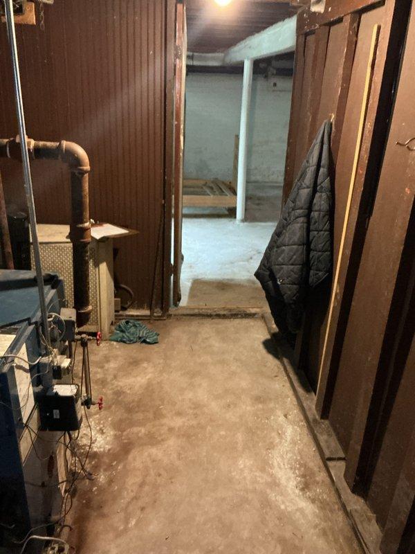Conducted on-site assessment of existing natural gas boiler system located in basement for replacement estimate. Current unit is over 10 years old and operational at time of inspection. Documented existing equipment configuration, piping layout, and installation environment to determine replacement specifications and requirements.
