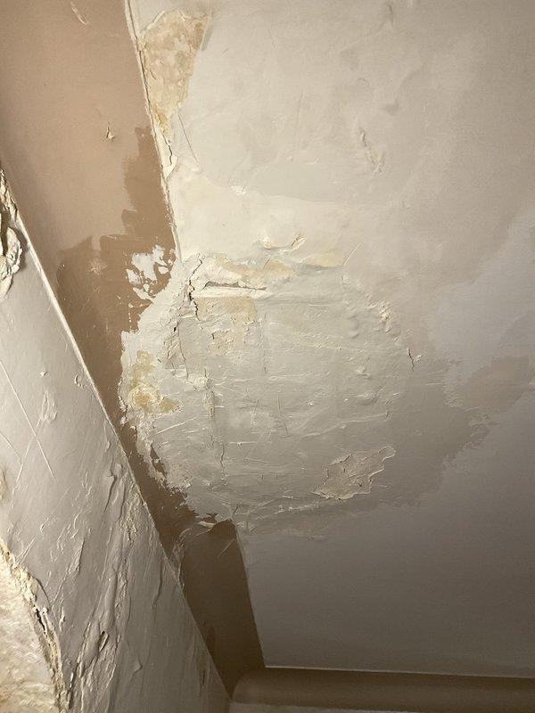 Responded to customer request for piping replacement assessment following extensive water damage to interior ceiling and walls. Upon inspection, discovered significant structural deterioration including exposed lath, peeling paint, brown water staining, and compromised plaster/drywall throughout the affected area, indicating prolonged moisture infiltration from failed plumbing above. Documented existing conditions and damage extent to provide accurate estimate for complete piping system remediation and subsequent ceiling repair work.