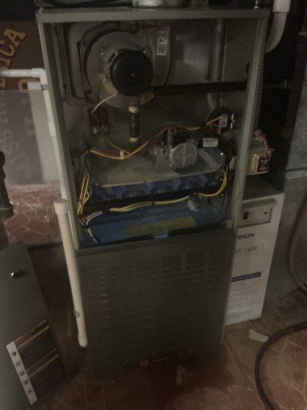 Completed comprehensive tune-up inspection on multi-zone HVAC system including gas furnace with Trion HE 1400 air handler located in basement, with additional units in backyard and second floor. Performed thorough inspection of all accessible components including burner assembly, heat exchanger, blower motor, gas lines, electrical connections, humidifier, thermostat, and hot water tank. All systems checked for proper operation and safety compliance.