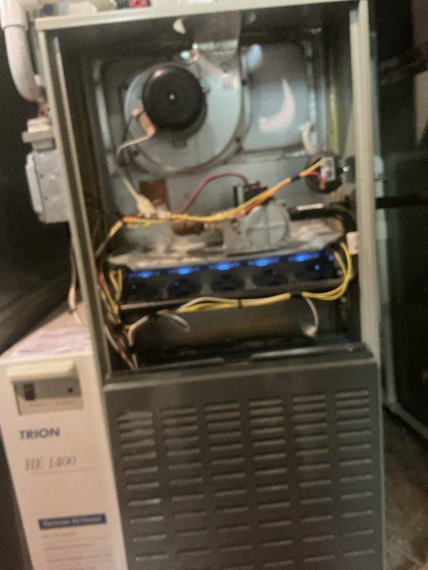 Completed comprehensive tune-up inspection on multi-zone HVAC system including gas furnace with Trion HE 1400 air handler located in basement, with additional units in backyard and second floor. Performed thorough inspection of all accessible components including burner assembly, heat exchanger, blower motor, gas lines, electrical connections, humidifier, thermostat, and hot water tank. All systems checked for proper operation and safety compliance.