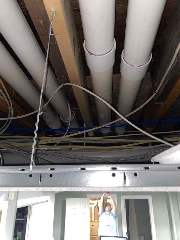Conducted comprehensive assessment of 6-year-old HVAC system including furnace and air conditioning unit with evaporator coil located in basement. Evaluated existing equipment condition, ductwork configuration, and PVC condensate drainage system to provide replacement estimate. Documented system layout including ceiling-mounted infrastructure, utility routing, and mechanical components to determine optimal replacement specifications and installation requirements.