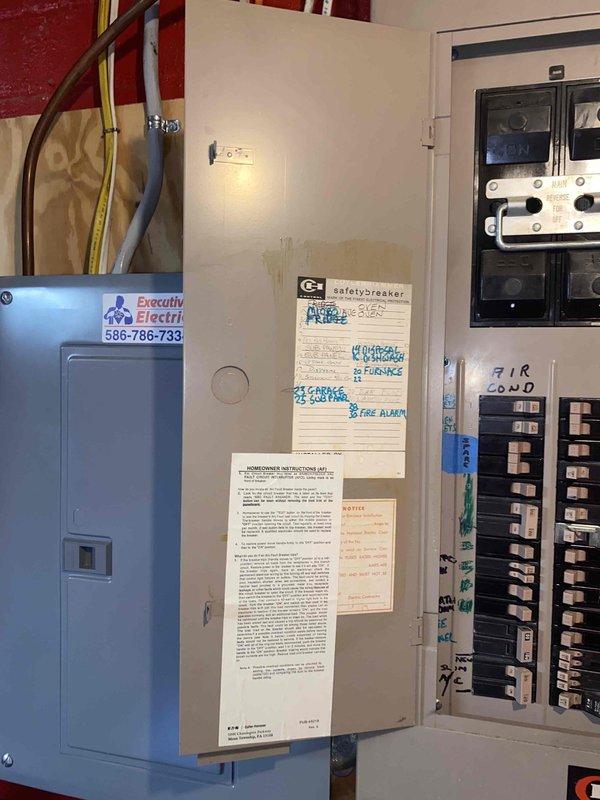 Responded to service call for non-operational air conditioning unit at rear of property. Upon arrival, inspected 20-year-old outdoor AC system that was completely non-functional with no sound or operation. Evaluated electrical disconnects for both west and east AC units, examined breaker panel configuration, and assessed overall system condition. Documented equipment age, electrical connections, and PVC refrigerant line routing. Photographed existing electrical service panels, disconnect switches, and outdoor condenser unit setup to provide comprehensive assessment for full system replacement estimate due to age and failure of equipment.