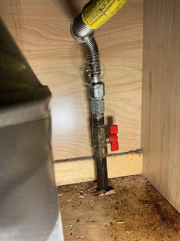 Responded to service call for non-operational water heater following gas meter replacement and reported gas leak at stove connection. Inspected gas supply system and identified compromised flexible gas connector line at stove installation point. Replaced faulty yellow flexible gas connector with new code-compliant unit, installed proper shutoff valve, and secured all connections. Pressure tested gas lines to verify system integrity and leak-free operation. Restored gas supply to water heater and stove, confirmed proper ignition and operation of both appliances.