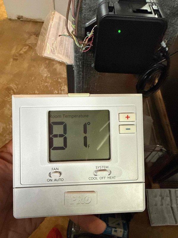 Responded to service call for 14-year-old Pro1 model T955W thermostat with failed LCD display located in foyer near front entrance. Upon arrival, confirmed thermostat screen was completely non-functional while unit remained powered. Inspected existing thermostat, documented current installation with photos showing wiring configuration and mounting location. Assessed compatibility for direct replacement versus upgrade options. Provided homeowner with recommendation for replacement unit due to age of existing equipment and availability of updated models with improved features and reliability.