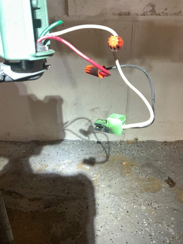 Responded to service call for boiler with control board damaged during previous electrical storm. Upon inspection in basement, confirmed control board was non-functional with visible damage to internal electrical components. Documented existing wiring configuration and electrical connections via photographs showing digital display, transformer assembly, and associated control wiring. Assessed replacement requirements for damaged control board and hydrostat component. Ordered replacement hydrostat under PO 1364849-001 for next-day delivery to shop. System remains offline pending arrival and installation of replacement parts.