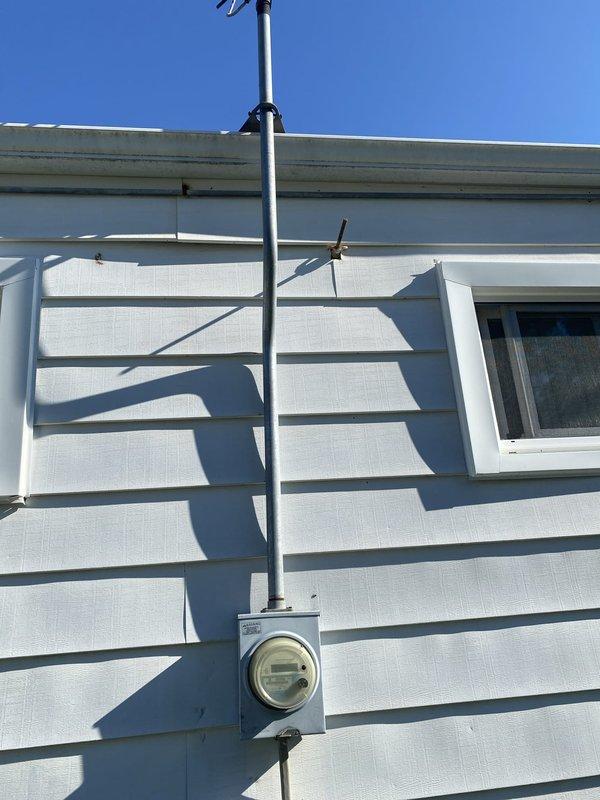 Completed full generator installation including electrical connections, transfer switch installation, and gas pipe routing. Installed exterior electrical conduit with proper mounting brackets and protective meter housing on building exterior. Configured transfer switch panel with proper wiring harnesses, completed all electrical terminations per code requirements, and submitted permit request for final inspection.