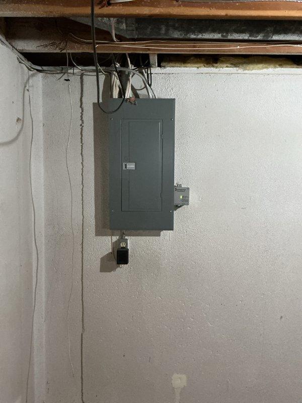 Successfully installed a 90,000 BTU high-efficiency furnace with humidifier and thermostat in basement utility area. Completed all electrical reconnections, installed new circuit breaker panel connections, and integrated humidification system with existing ductwork. Mechanical permit obtained and all work performed to code specifications, with unit qualifying for utility energy rebate program.