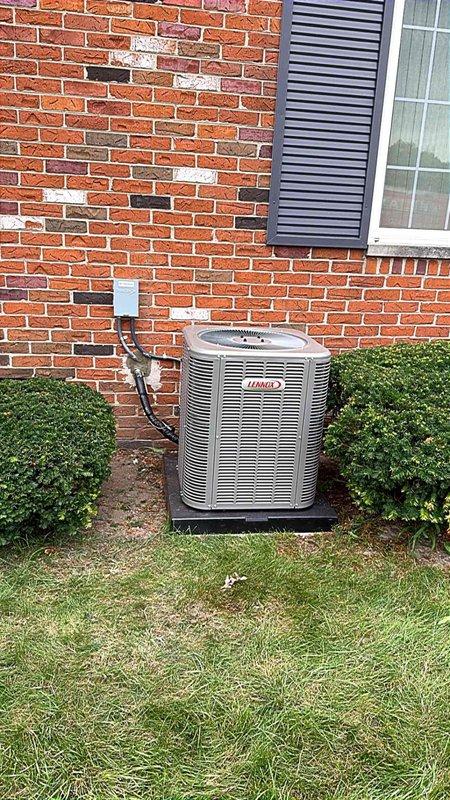 Completed installation of 2-ton Lennox air conditioning condenser unit and evaporator coil system. Positioned outdoor condenser unit in rear yard on composite pad against brick exterior wall with proper clearances maintained. Ran electrical conduit and wiring to wall-mounted disconnect box per code requirements. Installed Bryant evaporator coil in basement utility area integrated with existing furnace system. Performed system flush to remove contaminants from refrigerant lines. Connected refrigerant line set between outdoor condenser and indoor coil, evacuated system, and charged with proper refrigerant quantity per manufacturer specifications. Completed all electrical connections including reconnection of control wiring and power circuits. Secured all necessary mechanical and electrical permits prior to installation. Tested system operation including compressor function, airflow, temperature differential, and electrical draw to verify proper performance. System operating within manufa