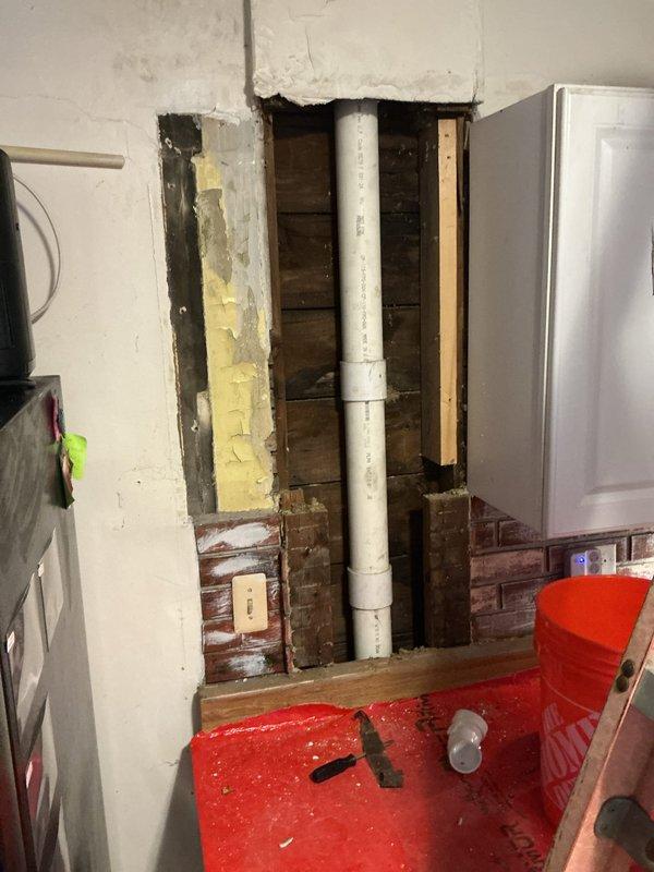 Completed stack repair per estimate by accessing the plumbing chase through interior wall opening. Removed drywall sections to expose vertical PVC drain stack and surrounding infrastructure, performed necessary repairs to the stack system, and prepared area for wall restoration. Work included coordination around existing HVAC ductwork within the wall cavity, with protective floor coverings maintained throughout the repair process.