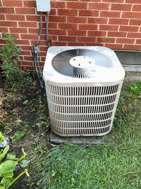 Completed comprehensive tune-up and inspection on 10+ year old HVAC system including basement-installed gas furnace and outdoor air conditioning condenser unit. Performed thorough examination of furnace interior components including blower motor assembly, gas valve connections, electrical control board, and all associated wiring harnesses. Verified proper operation of all safety controls and electrical connections throughout the system. Inspected outdoor condenser unit positioned on concrete pad adjacent to building foundation, checking refrigerant lines, electrical disconnect, conduit connections, and fan operation. Confirmed adequate clearance around outdoor unit and verified secure mounting on concrete slab. All components found to be functioning within normal operating parameters with organized wiring and proper installations maintained throughout both heating and cooling systems.
