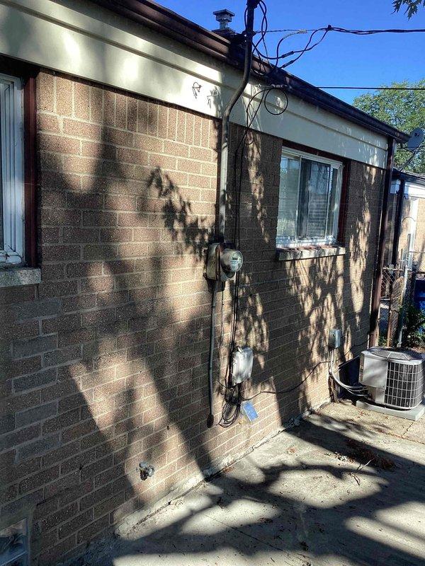 Conducted comprehensive on-site evaluation for complete HVAC system replacement at single-story residential property. Assessed existing furnace located in basement with undetermined age and ten-year-old air conditioning condenser unit positioned on exterior concrete pad adjacent to building. Performed visual inspection of both heating and cooling equipment, documented current system configuration, and photographed exterior condenser location and electrical service connections. Evaluated utility access points, electrical meter placement, and existing power supply infrastructure to determine installation requirements. Compiled equipment specifications and measurements necessary for replacement system sizing and provided estimate documentation to customer upon arrival as requested.