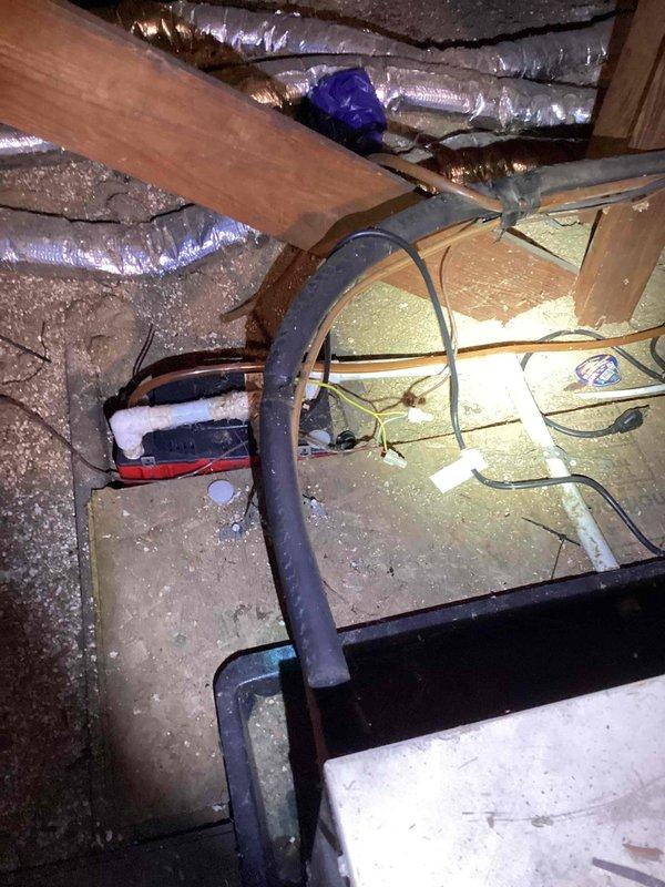 Conducted estimate for replacement of 10+ year old Spacepack system with attic-mounted natural gas furnace. Current equipment operational but aging, with visible dust accumulation on interior vent grilles and flexible ductwork in attic space. Documented existing installation including flexible duct routing, insulation condition, and equipment accessibility for replacement planning.