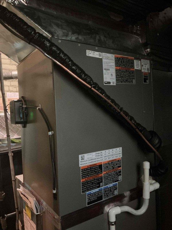 Completed full commercial air conditioning system replacement including removal and recycling of existing equipment. Installed new Lennox ML series 5-ton condenser unit (208-230V/1Ph/60Hz) on composite pad within existing cage, with code-compliant electrical disconnect and GFI protection. Flushed and pressure tested existing line set for reuse, installed 24-inch cased evaporator coil above furnace with necessary supply duct modifications. System tested and verified operational with proper refrigerant pressures and temperatures. All work performed under city mechanical and electrical permits with inspections completed and approved.