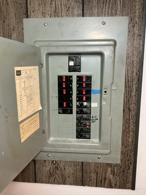 Conducted on-site evaluation for generator installation estimate at residential property with natural gas fuel source. Assessed existing electrical panel configuration and breaker capacity to determine integration requirements for new generator system. Documented electrical infrastructure including dual-panel setup and available circuit capacity to support automatic transfer switch installation and generator connection.