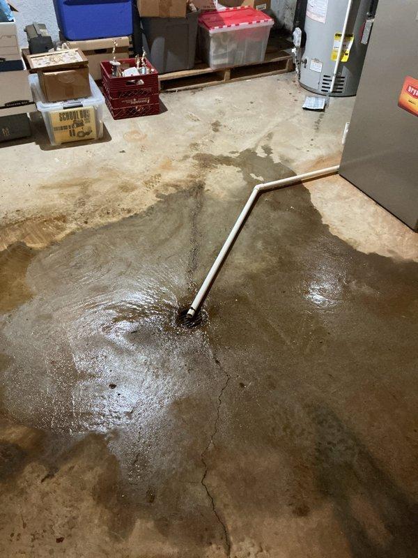 Responded to warranty callback for water backup issue following recent installation of Liberty Pumps Sump Jet water-powered backup sump pump system (Model S-110). Upon arrival, found significant basement flooding with standing water across concrete floor. Inspected sump pit installation and identified malfunction in water-powered backup system causing discharge failure. Diagnosed improper operation of backup pump mechanism, resulting in water overflow from pit during primary pump cycle. Corrected installation deficiencies, tested both primary and water-powered backup systems for proper operation, and verified adequate discharge flow. Confirmed sump pit water level maintained properly with no further backup or overflow conditions.