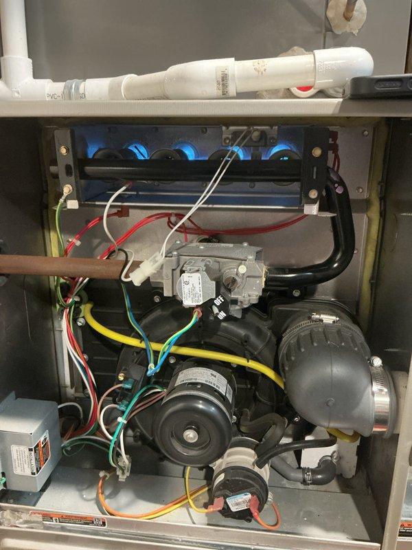 Completed comprehensive Gold Furnace Inspection on two residential HVAC units located in basement. Performed thorough inspection of gas-fired forced air furnace, verifying proper burner ignition with characteristic blue flame pattern, examining heat exchanger integrity, testing draft inducer motor operation, and inspecting gas valve assembly and all electrical connections. Evaluated external Lennox condensing unit, confirming fan motor operation, checking refrigerant lines, and assessing overall system condition. Both units operational and functioning within normal parameters at time of inspection.