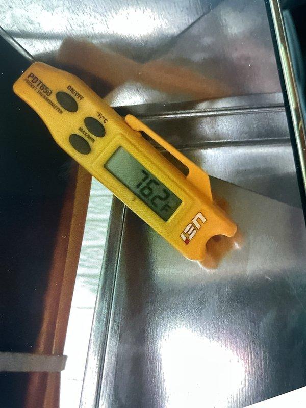 Responded to no cooling complaint on 9-year-old air conditioning system. Performed diagnostic testing and measured supply air temperature at 152°F, confirming lack of cooling. Measured system amperage at 11.48A using clamp meter on outdoor unit wiring. Identified refrigerant or compressor issue preventing proper cooling cycle. Also inspected humidifier pad per customer request during service call.