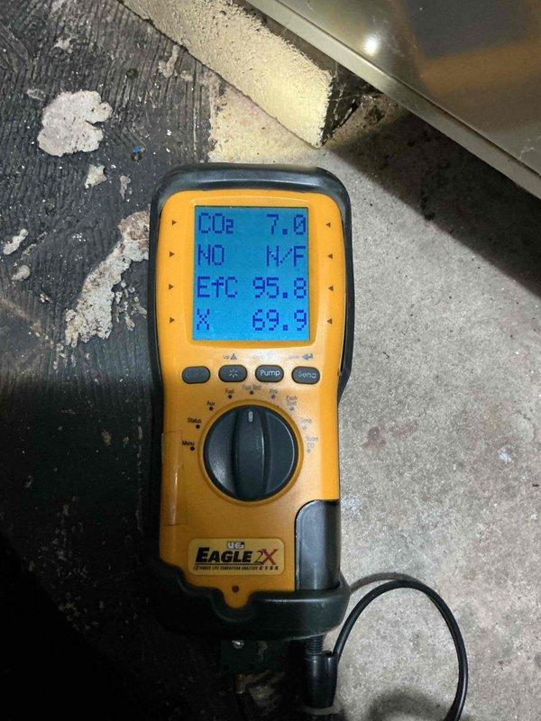 Completed comprehensive Gold AC and furnace inspection on 12-year-old furnace and 26-year-old air conditioning system with equipment located in basement and backyard. Performed detailed visual inspection of furnace burner assembly, verified all internal components, wiring connections, and flame sensors for proper operation. Conducted combustion analysis using digital analyzer, recording CO2 levels at 7.6% and efficiency temperature readings, confirming safe and efficient operation of heating system. Inspected air conditioning condenser unit, checked refrigerant lines, and verified system functionality. Both heating and cooling systems found operational at time of inspection, with all safety controls and mechanical components functioning within acceptable parameters for equipment age.