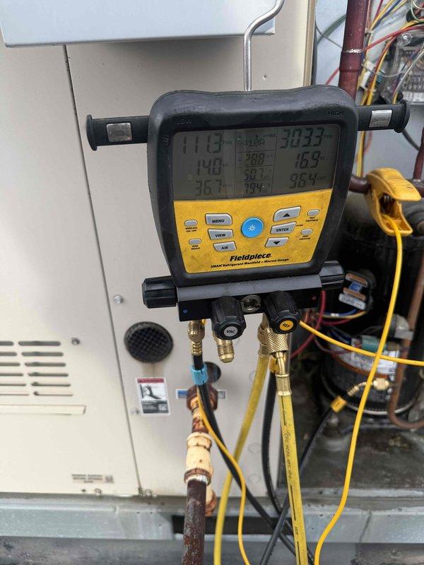 Responded to no cooling complaint on two rooftop AC units. Upon arrival, accessed roof and connected digital manifold gauges to both systems to diagnose refrigerant pressures and temperatures. Inspected electrical disconnects, control panels, and copper refrigerant lines, noting significant corrosion on exterior line sets. Performed system diagnostics using Fieldpiece manifold gauge set to measure operating pressures, superheat, and subcooling values. Evaluated compressor operation, electrical connections, and control circuitry. Identified cooling deficiencies and documented system conditions with pressure readings and visual inspection of deteriorated components. Both RTU systems assessed and diagnostic testing completed to determine root cause of inadequate cooling performance.