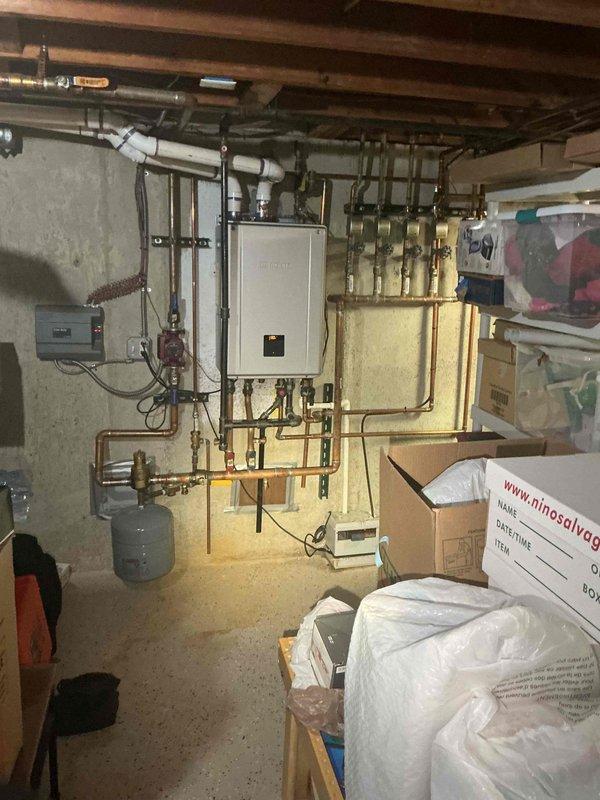 Responded to service call regarding propane or rotten egg odor detected near boiler exhaust pipe outside residence. Inspected 4-year-old wall-mounted boiler unit and associated hydronic baseboard heating system located in basement. Performed thorough examination of combustion chamber, heat exchanger, exhaust venting, and flue connections to identify source of gas odor. Checked all gas line connections, fittings, and valves for leaks using appropriate detection methods. Evaluated condensate pump operation and drainage system, noting customer concern about potential pump failure. Tested condensate pump functionality, inspected discharge lines, and verified proper condensate removal from boiler. Examined expansion tank, pressure relief valve, and circulating pump components. Assessed all copper piping connections and zone valves for proper operation. Verified electrical connections at control box and confirmed all safety controls functioning within manufacturer specifications. Documented 