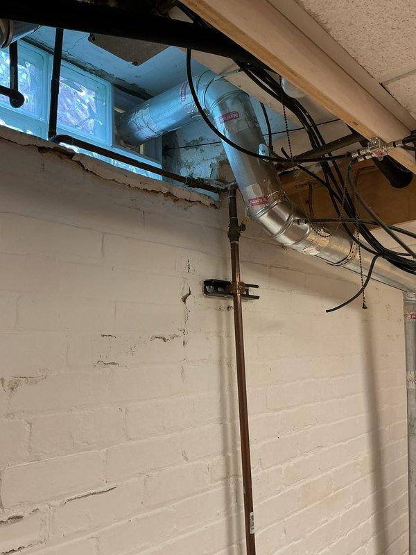 Installed new gas line from existing supply to dryer room in basement utility area. Routed black iron pipe along ceiling joists and down wall to dryer location, ensuring proper support and clearance from electrical conduits and HVAC ductwork. Connected gas line to dryer with approved flexible connector and performed pressure test to verify system integrity and absence of leaks.