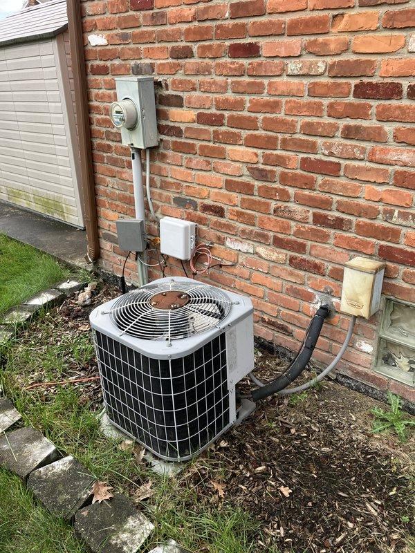 Conducted comprehensive evaluation of 20-year-old York furnace located in basement and existing air conditioning system for replacement estimate. Customer reported intermittent furnace operation with blower motor and control board cycling on and off unpredictably before complete shutdown. Documented current HVAC equipment configuration including outdoor condensing unit, Honeywell digital thermostat, and electrical service connections. Photographed existing installations to support replacement recommendations for both heating and cooling systems due to age and reliability concerns.