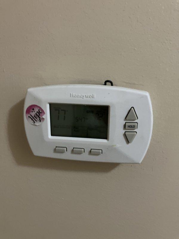 Conducted comprehensive evaluation of 20-year-old York furnace located in basement and existing air conditioning system for replacement estimate. Customer reported intermittent furnace operation with blower motor and control board cycling on and off unpredictably before complete shutdown. Documented current HVAC equipment configuration including outdoor condensing unit, Honeywell digital thermostat, and electrical service connections. Photographed existing installations to support replacement recommendations for both heating and cooling systems due to age and reliability concerns.